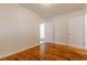Spacious bedroom with wood flooring, white walls, and multiple doorways for convenient access at 43 Lott Se Ave, Marietta, GA 30067