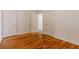 Inviting bedroom showcasing classic wood paneling, wood floors, and multiple doorways at 43 Lott Se Ave, Marietta, GA 30067