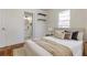 Comfortable bedroom with hardwood floors and a doorway leading to an ensuite bathroom at 43 Lott Se Ave, Marietta, GA 30067