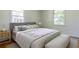 Bright bedroom with natural light, neutral tones, a comfortable bed, and stylish furnishings at 43 Lott Se Ave, Marietta, GA 30067
