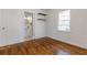 Sunny bedroom boasts hardwood floors and access to a stylishly tiled bathroom at 43 Lott Se Ave, Marietta, GA 30067