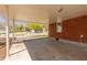 A covered carport with a concrete floor and red brick provides shelter from the elements at 43 Lott Se Ave, Marietta, GA 30067