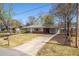 Charming single-story home featuring a long driveway and well-maintained front lawn at 43 Lott Se Ave, Marietta, GA 30067