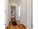 Hallway with wood flooring, closet, and laundry area featuring stacked washer and dryer units at 43 Lott Se Ave, Marietta, GA 30067