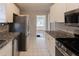 Updated kitchen with stainless steel appliances, granite countertops, and white cabinetry at 43 Lott Se Ave, Marietta, GA 30067