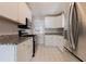 Updated kitchen with stainless steel appliances, granite countertops, and white cabinetry at 43 Lott Se Ave, Marietta, GA 30067