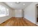 Hardwood floors and white walls brighten up this living room; the front door is to the left at 43 Lott Se Ave, Marietta, GA 30067