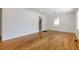 This open living room with hardwood floors offers lots of natural light and adjoins the kitchen at 43 Lott Se Ave, Marietta, GA 30067