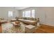 Bright living room with large windows and hardwood floors, furnished with stylish decor at 43 Lott Se Ave, Marietta, GA 30067