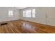 The living room has hardwood floors, windows, white walls, and a door at 43 Lott Se Ave, Marietta, GA 30067