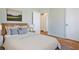 Cozy bedroom with hardwood floors, a comfortable bed, and serene decor at 43 Lott Se Ave, Marietta, GA 30067