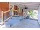 A covered patio featuring a screened-in porch, fan, brick, and wood railings provides outdoor comfort at 43 Lott Se Ave, Marietta, GA 30067