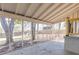 The screened-in porch with an exposed concrete floor provides a relaxing place to enjoy the backyard at 43 Lott Se Ave, Marietta, GA 30067
