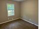 Cozy bedroom featuring neutral walls, a window providing natural light and plush carpeting at 1106 Hardy Cir, Dallas, GA 30157