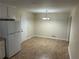 Spacious dining area featuring sleek vinyl floors and a modern lighting fixture at 1106 Hardy Cir, Dallas, GA 30157