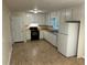 Functional kitchen featuring white cabinets and modern appliances, offering ample storage and counter space at 1106 Hardy Cir, Dallas, GA 30157