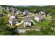 Expansive aerial view of a suburban neighborhood showcasing well-maintained homes and lush greenery at 13 Oakside Nw Ct, Cartersville, GA 30121