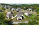 Expansive aerial view of a suburban neighborhood showcasing well-maintained homes and lush greenery at 13 Oakside Nw Ct, Cartersville, GA 30121