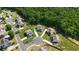 Aerial view of a neighborhood showcasing houses and lots surrounded by lush trees at 13 Oakside Nw Ct, Cartersville, GA 30121
