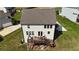 Drone shot of a home's back exterior, highlighting a two-story deck with stairs and manicured lawn at 13 Oakside Nw Ct, Cartersville, GA 30121
