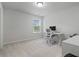 Bright bedroom featuring neutral carpet, a window for natural light, and a functional workspace with a desk and chair at 13 Oakside Nw Ct, Cartersville, GA 30121