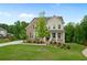 Charming two-story home with a brick and siding exterior, a well-manicured lawn, and a welcoming front porch at 13 Oakside Nw Ct, Cartersville, GA 30121