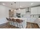 Spacious kitchen with a large island, pendant lighting, and modern appliances, perfect for entertaining at 13 Oakside Nw Ct, Cartersville, GA 30121
