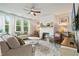 Comfortable living room featuring a fireplace, stylish decor, and plenty of natural light at 13 Oakside Nw Ct, Cartersville, GA 30121