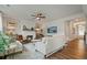 Bright living room with hardwood floors, fireplace, modern ceiling fan, and neutral decor at 13 Oakside Nw Ct, Cartersville, GA 30121
