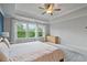 Bright main bedroom with tray ceilings, large windows, natural light, and plush carpeting at 13 Oakside Nw Ct, Cartersville, GA 30121