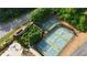 Aerial view of well-maintained tennis and basketball courts in a wooded community at 13 Oakside Nw Ct, Cartersville, GA 30121
