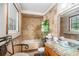 This bathroom features tile walls, glass sink, and granite countertops at 1608 Drakes Dr, Jonesboro, GA 30236