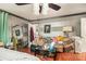 Bedroom featuring a ceiling fan, bed, and large mirror at 1608 Drakes Dr, Jonesboro, GA 30236