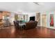 Cozy living room with hardwood floors, comfortable leather seating, and natural light at 1608 Drakes Dr, Jonesboro, GA 30236