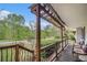 Relaxing porch view with comfortable seating, wrought iron railings, and a pergola at 1608 Drakes Dr, Jonesboro, GA 30236