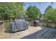 Spacious wooden deck area with outdoor grills, perfect for barbecues and outdoor cooking at 3935 Manor House Dr, Marietta, GA 30062