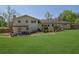 Expansive backyard featuring a covered deck and patio area, perfect for outdoor entertaining at 3935 Manor House Dr, Marietta, GA 30062