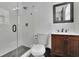 Modern bathroom with a glass shower, tile and wood vanity at 3935 Manor House Dr, Marietta, GA 30062