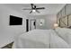 The main bedroom has a ceiling fan, large window and TV at 3935 Manor House Dr, Marietta, GA 30062