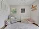 Sweet, bedroom with a chair, bed and toys at 3935 Manor House Dr, Marietta, GA 30062