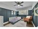 Stylish bedroom features a daybed, accent wall, reading chair, and natural light at 3935 Manor House Dr, Marietta, GA 30062