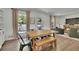 Dining area with wooden table, hardwood floors, and natural lighting at 3935 Manor House Dr, Marietta, GA 30062