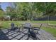 Outdoor firepit area with chairs, set on a pea gravel base, ideal for cozy gatherings at 3935 Manor House Dr, Marietta, GA 30062