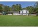 Charming white brick home with well-manicured lawn and covered carport at 3935 Manor House Dr, Marietta, GA 30062