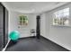 Home gym with punching bag, yoga ball, rubber flooring, and natural light from a window at 3935 Manor House Dr, Marietta, GA 30062