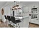 Modern kitchen with white cabinets, stainless steel appliances, quartz countertops, and stylish pendant lighting at 3935 Manor House Dr, Marietta, GA 30062