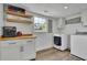 Functional laundry room with modern washer and dryer, custom cabinets, and ample counter space at 3935 Manor House Dr, Marietta, GA 30062