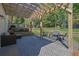 Stylish patio with pergola, elegant herringbone brickwork, and comfortable seating for relaxing outdoors at 3935 Manor House Dr, Marietta, GA 30062