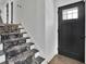 View of front door and staircase with carpet at 3935 Manor House Dr, Marietta, GA 30062