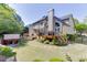 Backyard featuring well-manicured landscaping, a wooden deck, and a seating area at 1315 Chattahoochee Run Dr, Suwanee, GA 30024